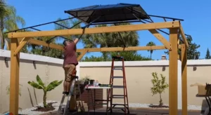 the gazebo that we used to anlyse the cost og building a gazebo - the image shows blake building a gazebo