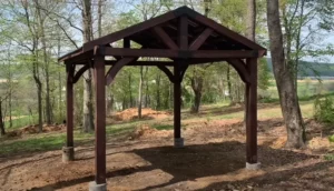 Backyard Discovery Arlington All Cedar Gazebo Kit anchored on concrete footings